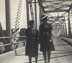 People posing with bridges