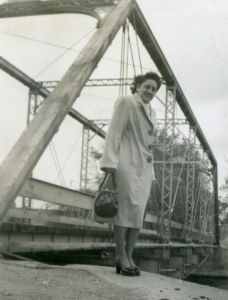 People posing with bridges