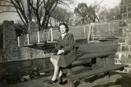 People posing with bridges