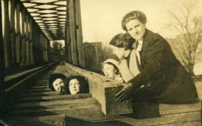 People posing with bridges