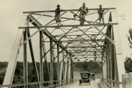 People posing with bridges